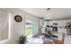 Bright eat-in kitchen featuring stainless steel appliances, white cabinetry, and access to the backyard, perfect for indoor-outdoor living at 3044 Camino Real S Dr, Kissimmee, FL 34744