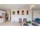 Bright eat-in kitchen featuring stainless steel appliances and open wall decor, connecting seamlessly with other living spaces at 3044 Camino Real S Dr, Kissimmee, FL 34744
