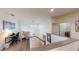 Second floor landing featuring a desk, crib, and access to the laundry room at 3044 Camino Real S Dr, Kissimmee, FL 34744