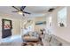 Bright living room featuring modern sofas, recessed shelving and an open entry way at 3044 Camino Real S Dr, Kissimmee, FL 34744