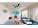 Comfortable living room with a large sectional couch, ceiling fan, and stylish decor, great for relaxation and entertaining at 3044 Camino Real S Dr, Kissimmee, FL 34744