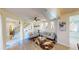 Open concept living room with modern decor, hardwood floors, and staircase leading to the second floor at 3044 Camino Real S Dr, Kissimmee, FL 34744