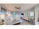 A spacious main bedroom features blue accents, a ceiling fan, and hardwood floors at 3044 Camino Real S Dr, Kissimmee, FL 34744