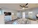 A main bedroom provides hardwood floors, a ceiling fan, and access to both the bathroom and walk-in closet at 3044 Camino Real S Dr, Kissimmee, FL 34744