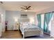 The bright main bedroom features hardwood floors and natural lighting at 3044 Camino Real S Dr, Kissimmee, FL 34744