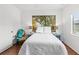 Inviting bedroom with wood floors, a large nature art piece, and soft lighting at 3331 Windsor Lake Cir, Sanford, FL 32773