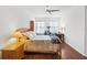 Bright bedroom features a ceiling fan, wood floors, and charming décor at 3331 Windsor Lake Cir, Sanford, FL 32773
