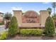 A welcoming community sign surrounded by professionally maintained landscaping at 3331 Windsor Lake Cir, Sanford, FL 32773