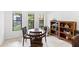 Cozy dining area with a charming table, comfortable seating, and a view of the outdoors at 3331 Windsor Lake Cir, Sanford, FL 32773