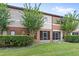 Charming home exterior with screened in lanai, manicured lawn, and lush landscaping at 3331 Windsor Lake Cir, Sanford, FL 32773
