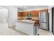 Well-lit kitchen with stainless steel appliances, ample cabinet space, and a convenient center island at 3331 Windsor Lake Cir, Sanford, FL 32773