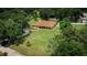 Aerial view of a home with a large lot, mature trees, and lush green landscaping at 3443 Wild Myrtle Ct, Windermere, FL 34786