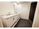 Bathroom featuring double sink vanity with marble countertop and modern fixtures at 3443 Wild Myrtle Ct, Windermere, FL 34786