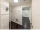 Walk-in closet with metal shelving and dark wood tile flooring leading into another room at 3443 Wild Myrtle Ct, Windermere, FL 34786