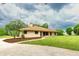 Charming ranch-style home with well-maintained lawn and landscape featuring mature trees and lovely curb appeal at 3443 Wild Myrtle Ct, Windermere, FL 34786
