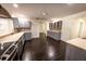 Stylish kitchen with stainless steel appliances, dark wood floors, and spacious layout at 3443 Wild Myrtle Ct, Windermere, FL 34786