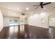Spacious living room featuring modern lighting, dark wood floors and views of the pool at 3443 Wild Myrtle Ct, Windermere, FL 34786