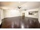 Spacious living room featuring modern lighting, dark wood floors and easy access to the kitchen at 3443 Wild Myrtle Ct, Windermere, FL 34786