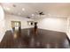 Expansive living space with dark wood floors, multiple ceiling fans, and abundant natural light at 3443 Wild Myrtle Ct, Windermere, FL 34786