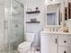 Modern bathroom features glass shower, vanity, toilet and stylish décor at 348 Sigmund Loop, Davenport, FL 33837