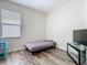 Simple bedroom design featuring wood flooring and natural light at 348 Sigmund Loop, Davenport, FL 33837