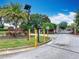 Secure community entrance with well-maintained landscaping, ensuring a safe and welcoming environment for residents at 348 Sigmund Loop, Davenport, FL 33837