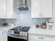 Modern kitchen featuring stainless steel appliances and ample countertop space at 348 Sigmund Loop, Davenport, FL 33837