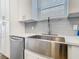 Modern kitchen with stainless steel appliances, and a large farmhouse sink at 348 Sigmund Loop, Davenport, FL 33837