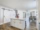 Open kitchen layout showcasing an island with a view of dining area and backyard at 348 Sigmund Loop, Davenport, FL 33837