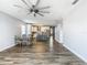 Open-concept space with kitchen, dining, and living areas featuring modern finishes at 348 Sigmund Loop, Davenport, FL 33837