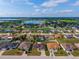 Community shot showcasing a neighborhood near a lake with blue skies at 351 Cloverdale Rd, Winter Haven, FL 33884