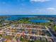 An aerial community view with lakes and a pinpoint on a property at 351 Cloverdale Rd, Winter Haven, FL 33884