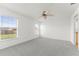 Light-filled bedroom with ceiling fan and large windows at 351 Cloverdale Rd, Winter Haven, FL 33884