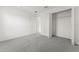 This bedroom features plush gray carpeting and a closet for optimal storage at 351 Cloverdale Rd, Winter Haven, FL 33884