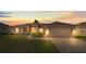 Charming single-Gathering home with manicured lawn and attached two-car garage at sunset at 351 Cloverdale Rd, Winter Haven, FL 33884