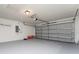 This garage has a gray door, an electric box and plenty of space at 351 Cloverdale Rd, Winter Haven, FL 33884