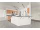 Bright kitchen features stainless steel appliances, tiled floors and breakfast bar at 351 Cloverdale Rd, Winter Haven, FL 33884
