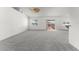 Spacious living room with neutral carpet and sliding glass door to patio at 351 Cloverdale Rd, Winter Haven, FL 33884