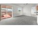 Bright living room with sliding glass door and neutral carpet at 351 Cloverdale Rd, Winter Haven, FL 33884