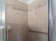 Shower with safety bar and neutral tile at 351 Cloverdale Rd, Winter Haven, FL 33884