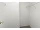 A clean, organized walk-in closet with white shelving at 351 Cloverdale Rd, Winter Haven, FL 33884