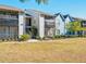 Condo exterior features multiple units, well-maintained landscaping, and ample open space at 3772 Idlebrook Cir # 100, Casselberry, FL 32707