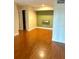 Spacious living room with hardwood floors and a modern accent wall at 3772 Idlebrook Cir # 100, Casselberry, FL 32707