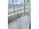 Screened patio offering outdoor space with a parking lot view at 3772 Idlebrook Cir # 100, Casselberry, FL 32707