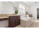 Soaking tub is the focal point of this primary bathroom with dual vanities at 3868 Whitewood Ct, Oviedo, FL 32766