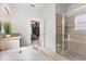A spacious primary bath featuring a soaking tub and a glass enclosed shower stall at 3868 Whitewood Ct, Oviedo, FL 32766