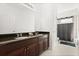 Bathroom showcasing a double sink vanity and separate shower and tub at 3868 Whitewood Ct, Oviedo, FL 32766