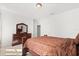 Bedroom featuring neutral carpet, simple light fixture and paneled door at 3868 Whitewood Ct, Oviedo, FL 32766