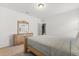 Bedroom featuring a wood-framed bed, dresser, and a calming, neutral color scheme at 3868 Whitewood Ct, Oviedo, FL 32766
