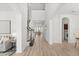 Bright and airy foyer with high ceilings, wood floors, and staircase leading to the second floor at 3868 Whitewood Ct, Oviedo, FL 32766